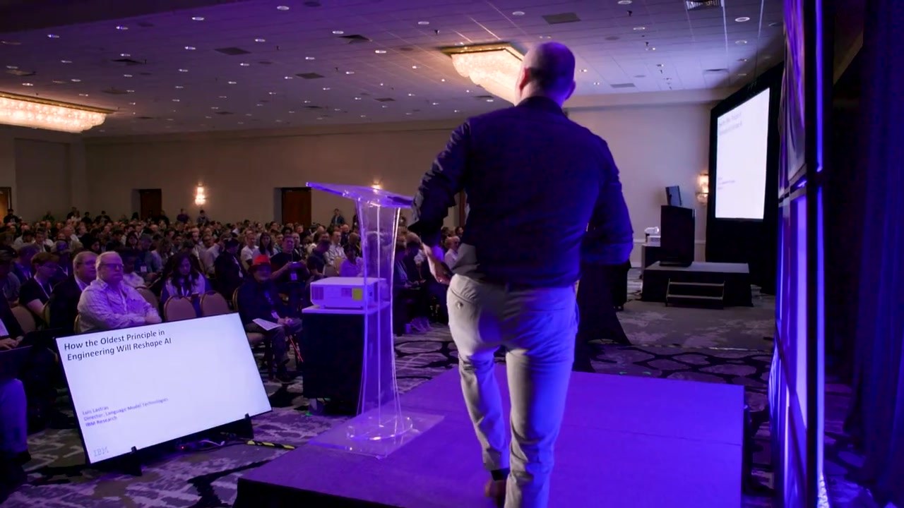 An audience watching a keynote in a ballroom at All Things AI 2026 in Durham